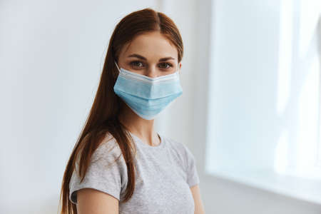 woman patient in medical mask hospital protectionの写真素材