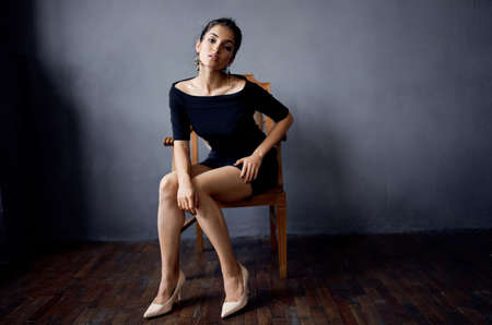 pretty woman posing model attractive look decoration smile dark backgroundの写真素材