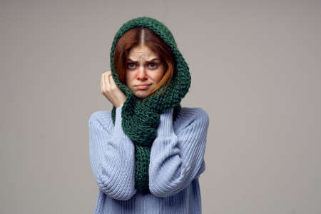red-haired woman green scarf on the head close-upの写真素材