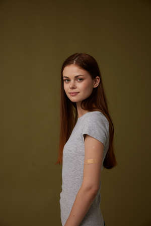 woman shows vaccinated hand covid-19 passport Studioの写真素材