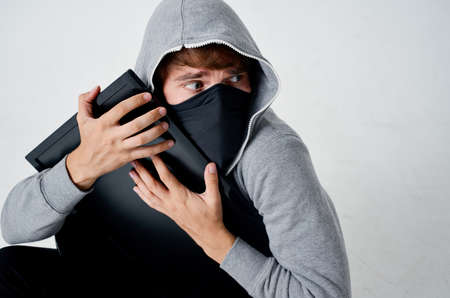 hacker hooded head hacking technology security light backgroundの写真素材