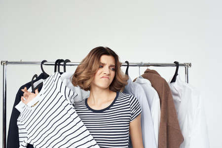 pretty woman clothes hanger shopping isolated backgroundの写真素材