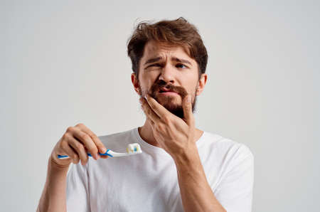 emotional man hygiene toothpaste morning isolated backgroundの写真素材