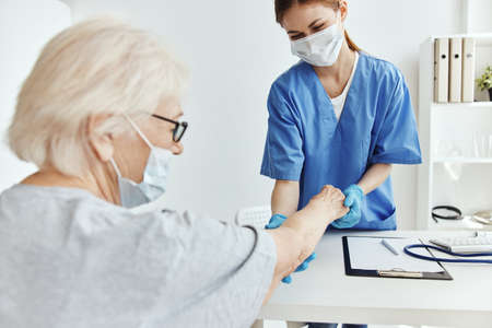 elderly woman and doctor examination health careの写真素材