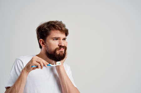 bearded man dental care dentistry toothache isolated backgroundの写真素材