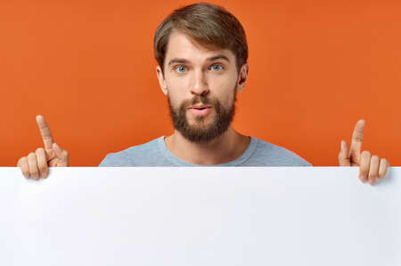 funny man holding a white banner design studio lifestyleの写真素材