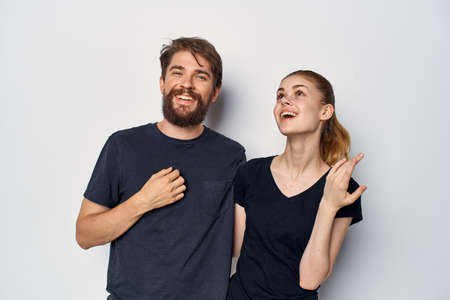 a young couple in black t-shirt sunglasses posing studio lifestyleの写真素材