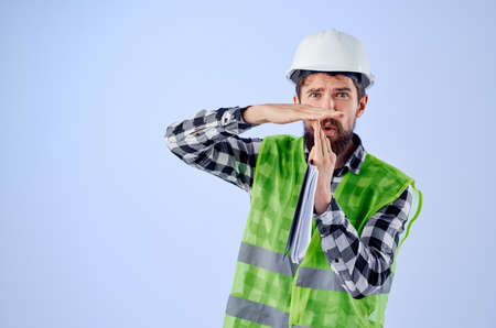 male worker with documents and drawings blueprints isolated backgroundの写真素材