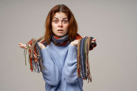 red-haired woman health problems temperature light backgroundの写真素材