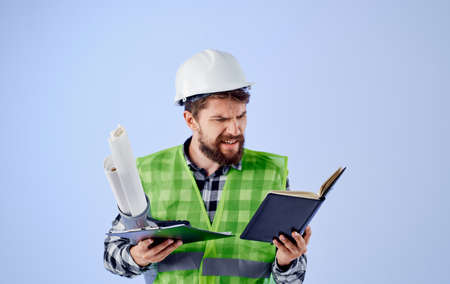 male builder in a white helmet blueprints Professional studio industryの写真素材
