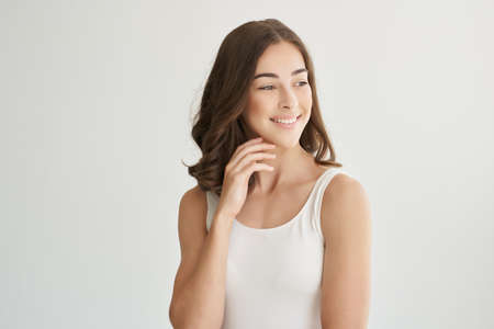 woman in white t shirt smile posing fashion isolated backgroundの写真素材