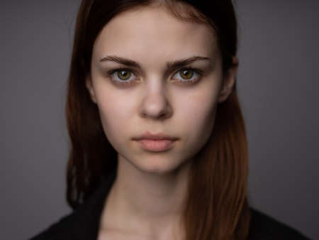 woman with serious facial expression hairstyle closeupの写真素材