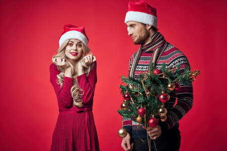 emotional man and woman christmas holiday gifts red backgroundの写真素材