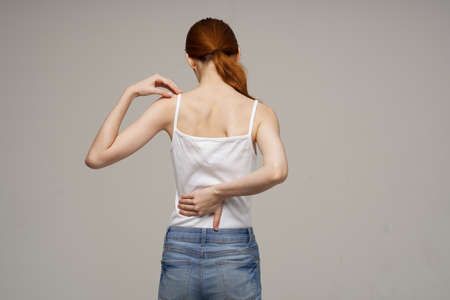 woman back pain health problems osteoporosis isolated backgroundの写真素材