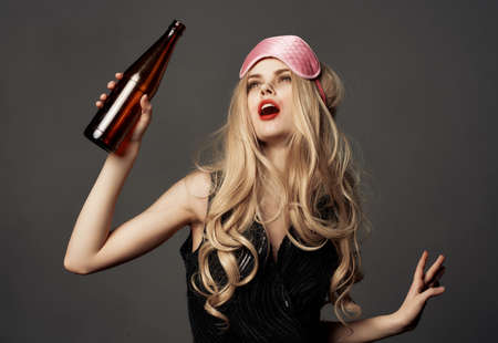 drunk woman mask for sleep party holiday lifestyle isolated backgroundの写真素材