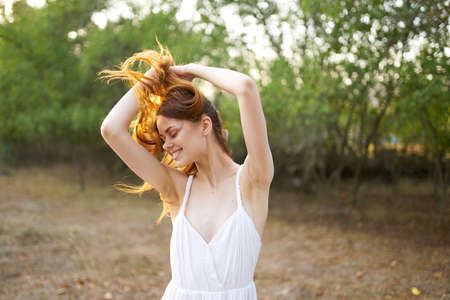 Woman in white dress nature trees vacation lifestyle