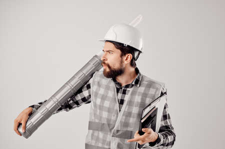 male builder with documents and drawings blueprints isolated background