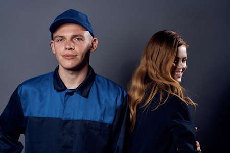 working man and business woman standing side by side chatting