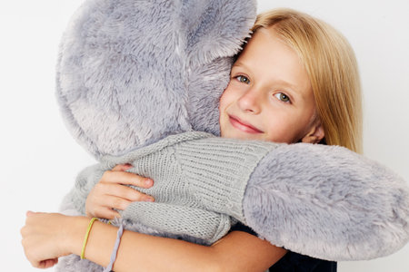 emotional girl in a black t-shirt grimace on a light backgroundの写真素材