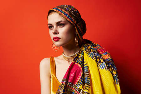 beautiful woman multicolored shawl ethnicity african style isolated backgroundの写真素材