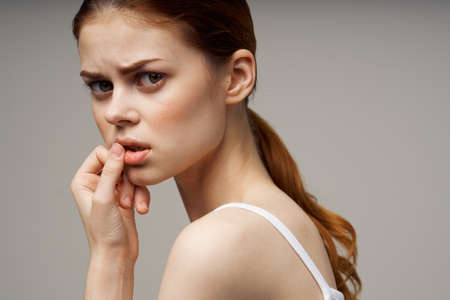 woman holding on to the neck health problems joint studio treatmentの写真素材