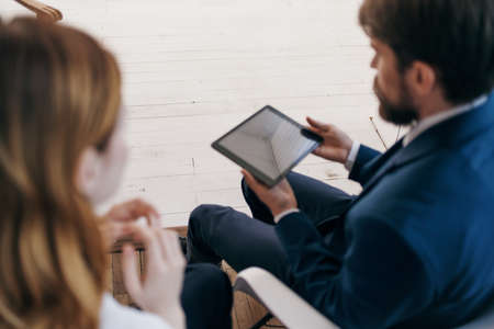 business man and woman work with a tablet technology officeの写真素材