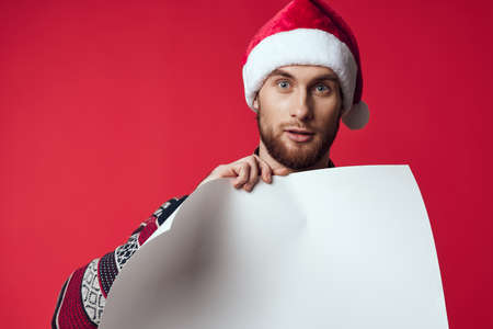 emotional man in a christmas white mockup poster isolated backgroundの写真素材
