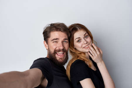 Man and woman together selfie communication emotions isolated backgroundの写真素材