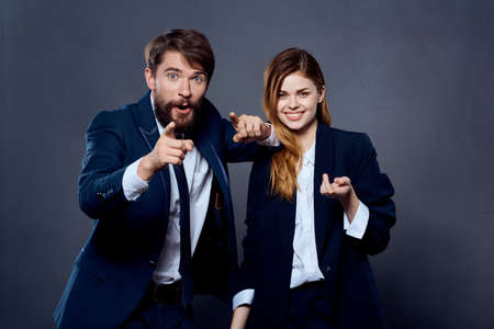 business men and women in suits are standing next to the team