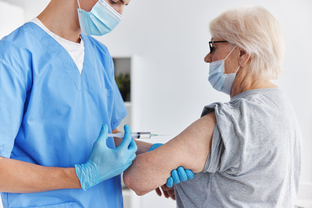 male doctor arm injection vaccine passport immunization safetyの写真素材