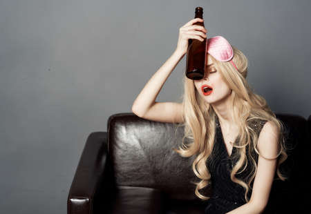 female on the couch mask for sleep party holiday lifestyle dark background