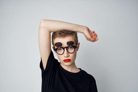 short haired woman hand gesture Red lips glamor light backgroundの写真素材