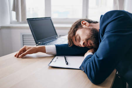 manager working for a laptop in the office emotions internet officialの写真素材