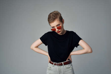 short haired woman with sunglasses fashion isolated backgroundの写真素材