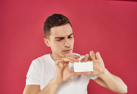 emotional man in white t-shirt business card Copy Spaceの写真素材