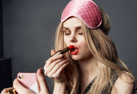 drunk woman mask for sleep party holiday lifestyle isolated backgroundの写真素材