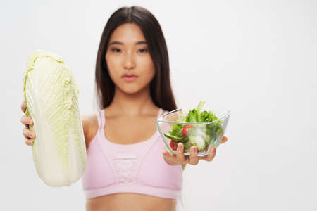 woman of asian appearance plate of beijing cabbage salad healthy foodの写真素材