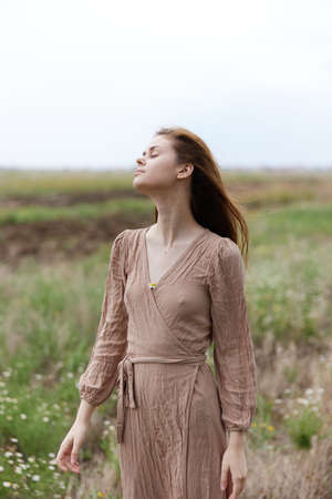 portrait of a beautiful woman long hair dresses charm outdoors supply Lifestyleの写真素材