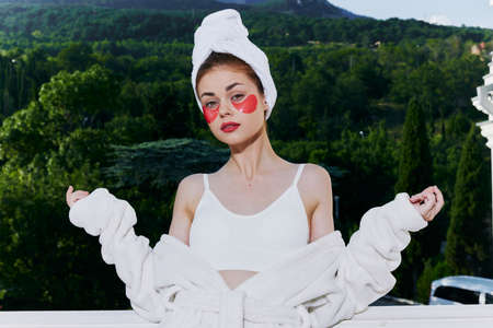 Attractive young woman with patches on his face admires nature unalteredの写真素材