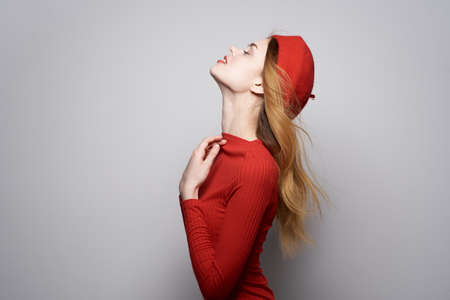 cheerful woman hand gesture fun Red lips luxury light backgroundの写真素材