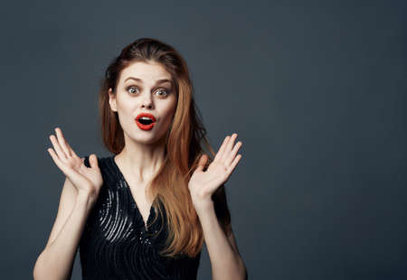 cheerful woman Red hair charm posing cosmetics dark backgroundの写真素材