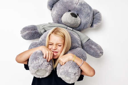 happy child with teddy bear a toy isolated background