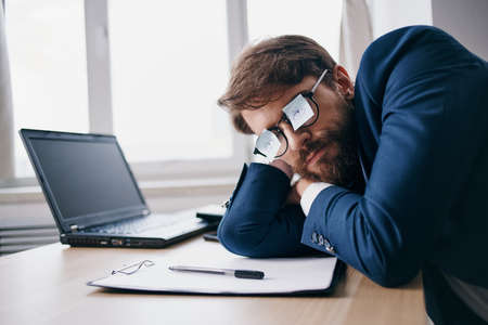 manager working for a laptop in the office emotions internet officialの写真素材