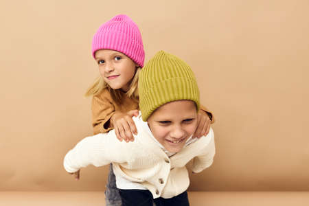 happy children hugs laughter friendship Studio emotionsの写真素材