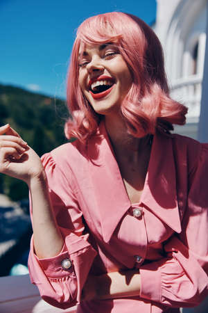 portrait of a woman in a pink dress outdoors nature view Relaxation concept