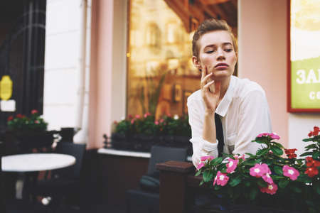 female in a summer cafe outdoors rest fun walking around town educationの写真素材