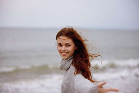 pretty woman with long hair on the beach nature landscape walk Relaxation conceptの写真素材
