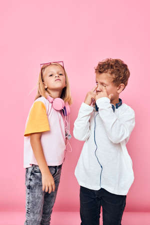 boy and girl casual wear headphones entertainment