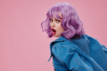 Portrait of a charming lady stylish clothes posing emotions cosmetics hairstyle studio model unalteredの写真素材