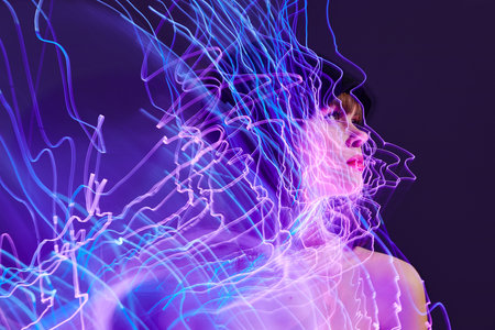 Pretty young female disco neon lines dispensing fashion color background unalteredの写真素材